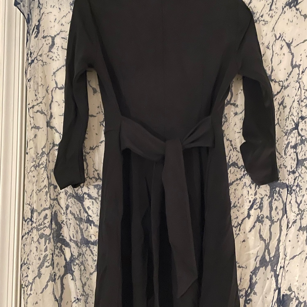 Falls just above the knee. Perfect with textured tights and booties.